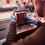 the technician repairs a broken tablet computer in 2021 08 28 03 10 18 utc