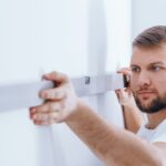 Is A Pre-purchase Home Inspection Worth The Cost? Worker Checking The Wall PANFFWC 1 150x150