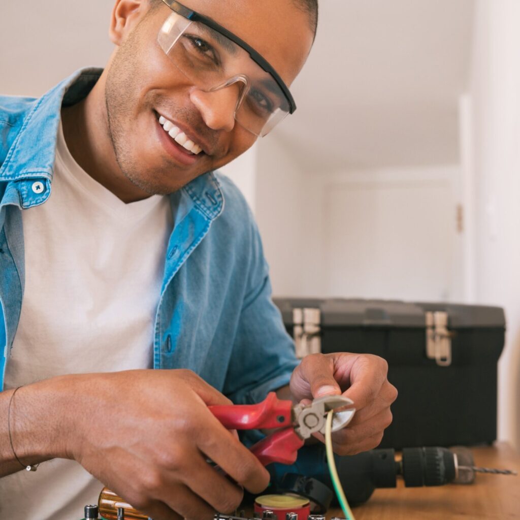 latin man fixing electricity problem at home xzcvnwa scaled.jpg